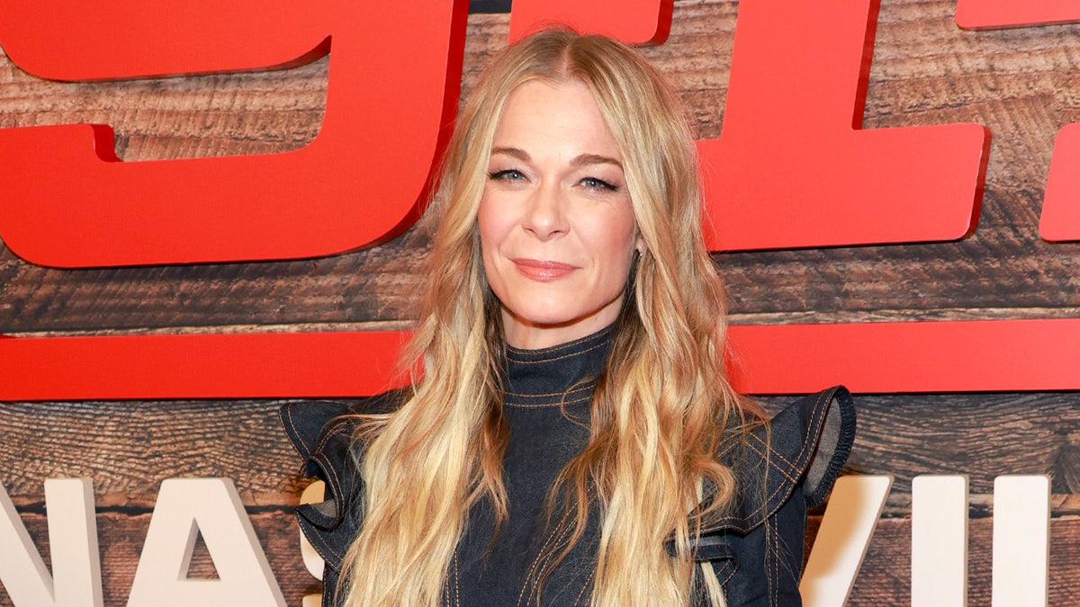 LeAnn Rimes smiles on red carpet