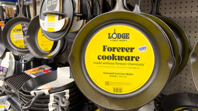 A selection of Lodge cast iron cookware products in a shop display