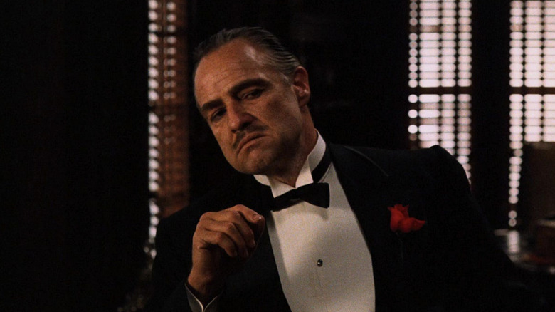 Vito Corleone (Marlon Brando) in a tuxedo in his office in The Godfather