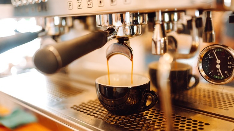 Espresso being prepared by a machine.