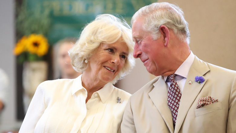 Prince Charles, Prince of Wales and Camilla, Duchess of Cornwall look at eachother as they reopen the newly-renovated Edwardian community hall The Strand Hall during day three of a visit to Wales on July 4, 2018