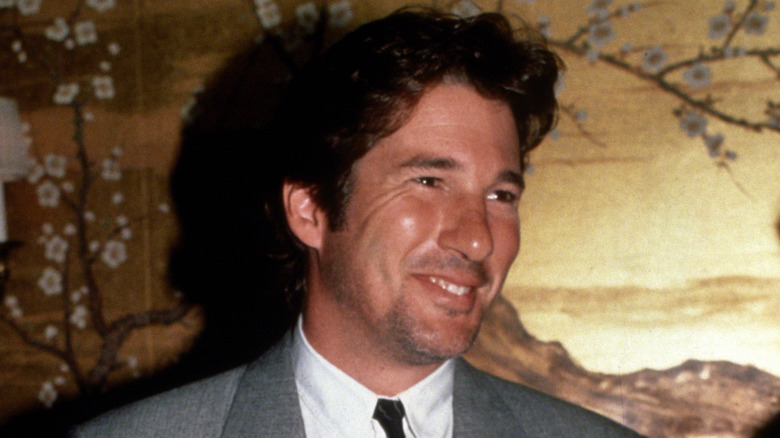 1980s heartthrob Richard Gere wearing a suit and smiling