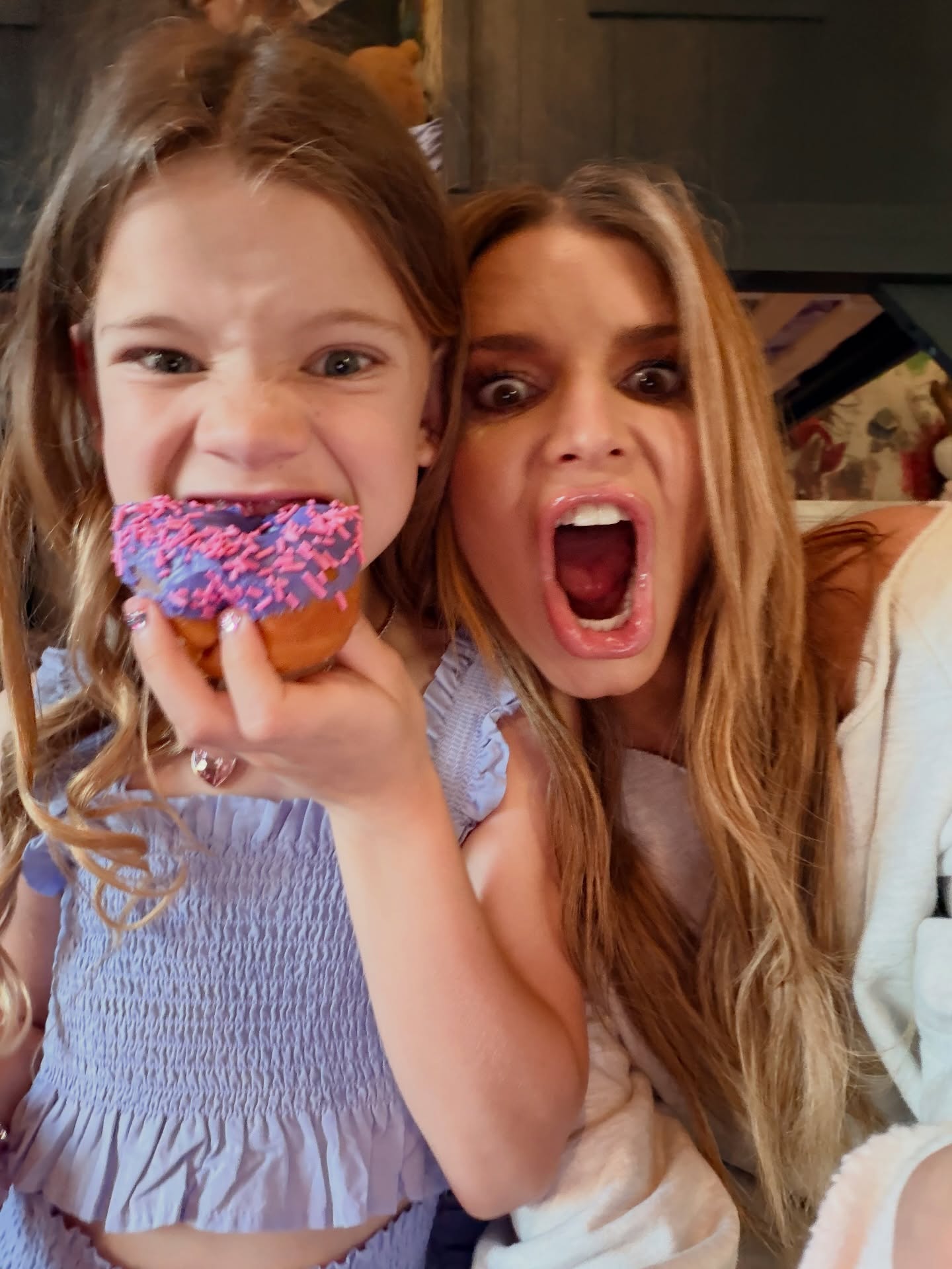 Birdie Mae Johnson (left) and  mom Jessica Simpson celebrate her 7th birthday with a doughnut!