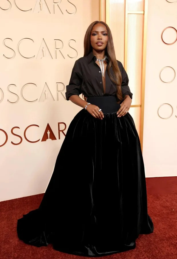 Ryan Destiny took a modern approach to red carpet fashion with an AMI Paris look featuring a crisp shirt and voluminous velvet skirt.