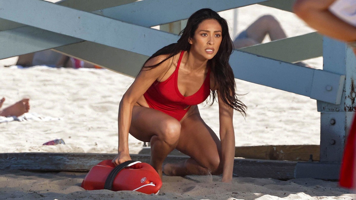 Shay Mitchell filming a scene for the "Baywatch" reboot.