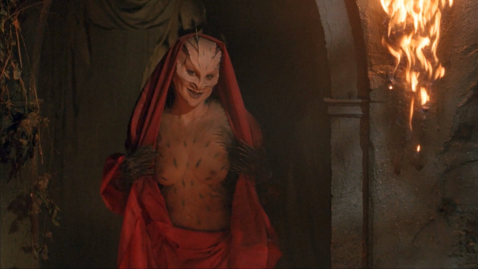 A quilled woman, breasts out, in a robe.