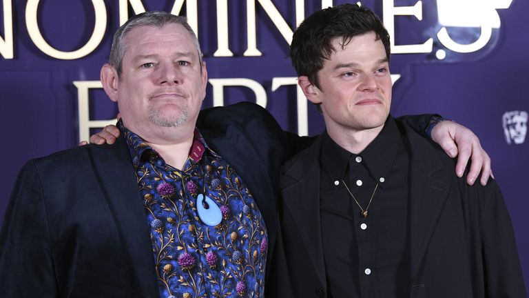 John Davidson, left, with Robert Aramayo, who plays him in I Swear, at the BAFTA film nominees party. Pic: AP