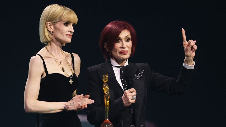 (L-R) Kelly and Sharon Osbourne accept the lifetime achievement award for Ozzy Osbourne. Pic: Reuters