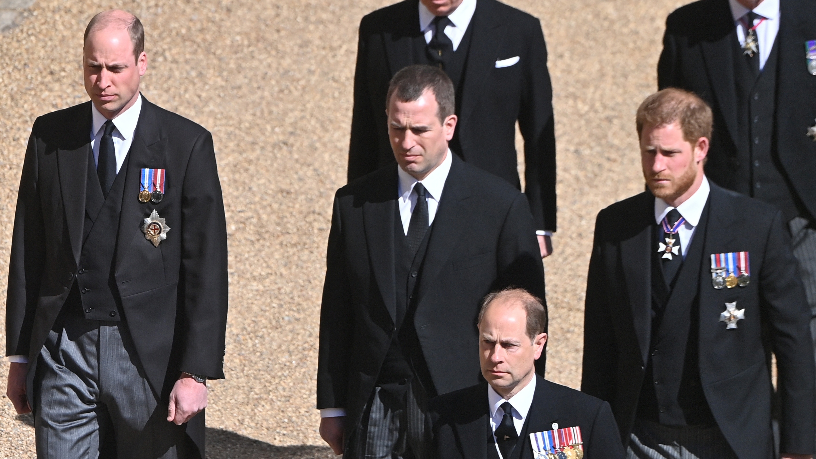 Prince William, Prince Harry, Peter Phillips and Prince Edward are seen walking in the funeral procession for Prince Philip