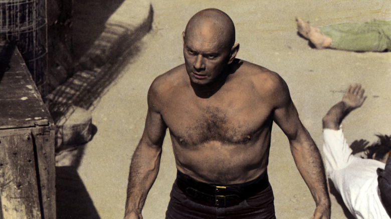 Carson walks away from a group of bodies in 