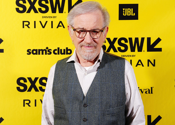 Steven Spielberg wearing glasses and a vest at SXSW event, ahead of Oscars controversy involving Timothée Chalamet as a sage.