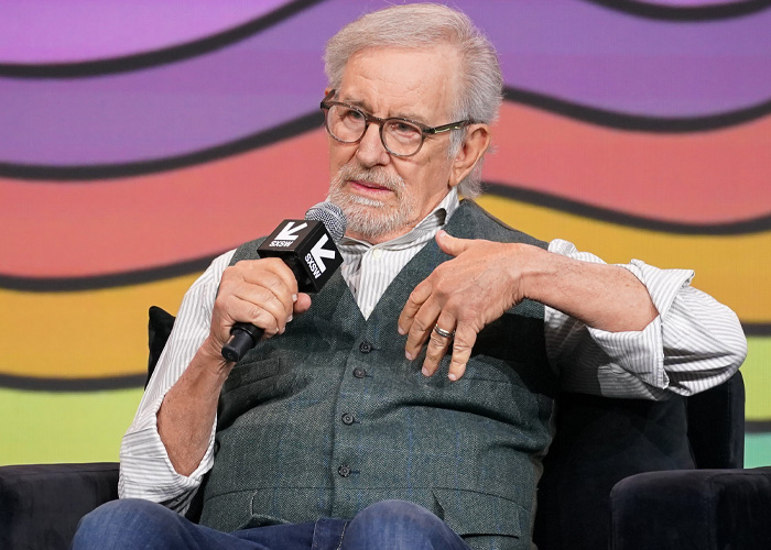 Steven Spielberg speaking into a microphone during SXSW panel, discussing Timothée Chalamet and film industry topics.