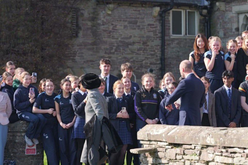 Prince William and Princess Anne speaking with students from the local college after the memorial service of Dame Shân Legge-Bourke in Wales