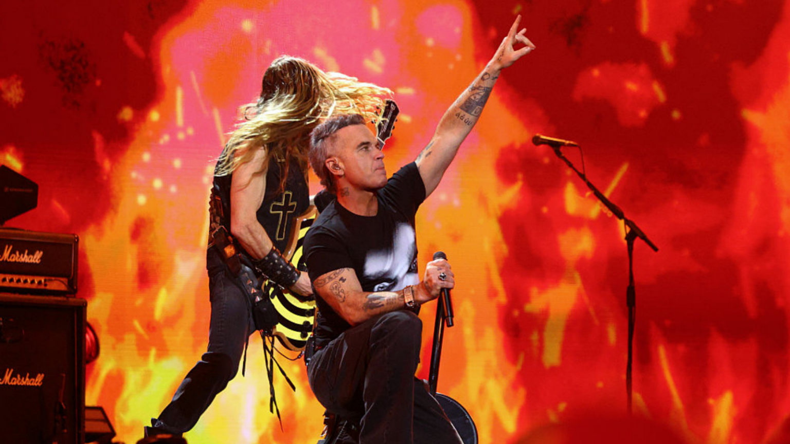 Robbie Williams performs on stage in tribute to Ozzy Osbourne during The BRIT Awards 2026 at Co-op Live on February 28, 2026 in Manchester, England.