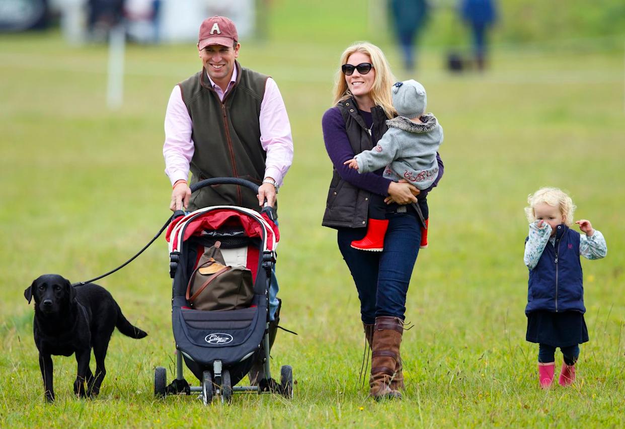 Peter Phillips and Autumn Kelly with their daughters Savannah and Isla at the Gatcombe Horse Trials in September 2013.Credit: Getty Images