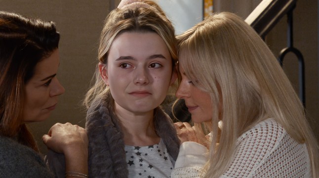 Carla and Lisa lean on crying Betsy's shoulders in Corrie