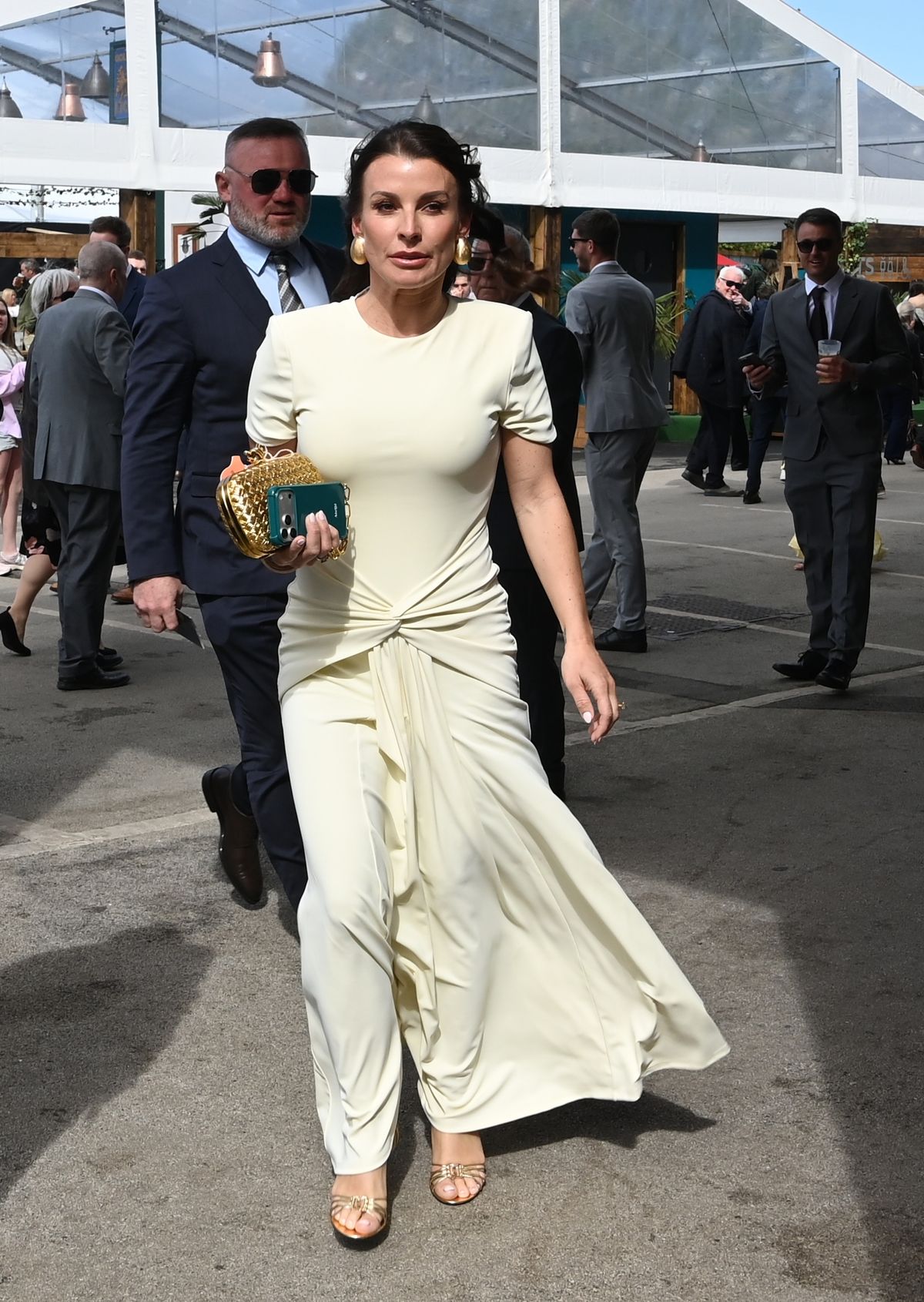 Wayne was suited and booted as he and Coleen made their way into Aintree