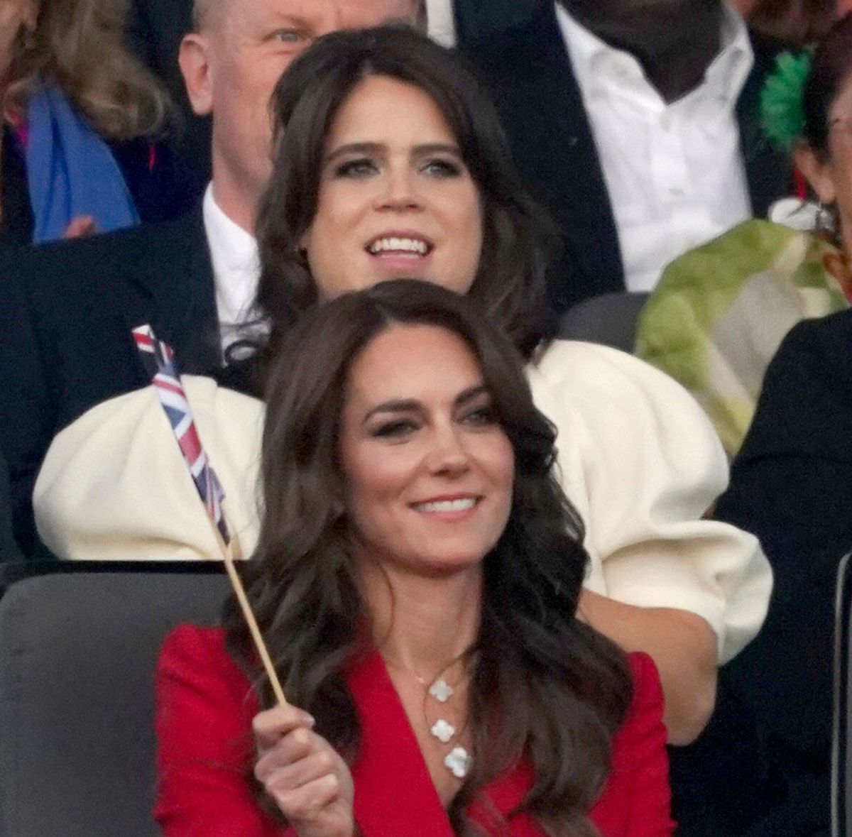 Princess Eugenie sits behind the Princess of Wales