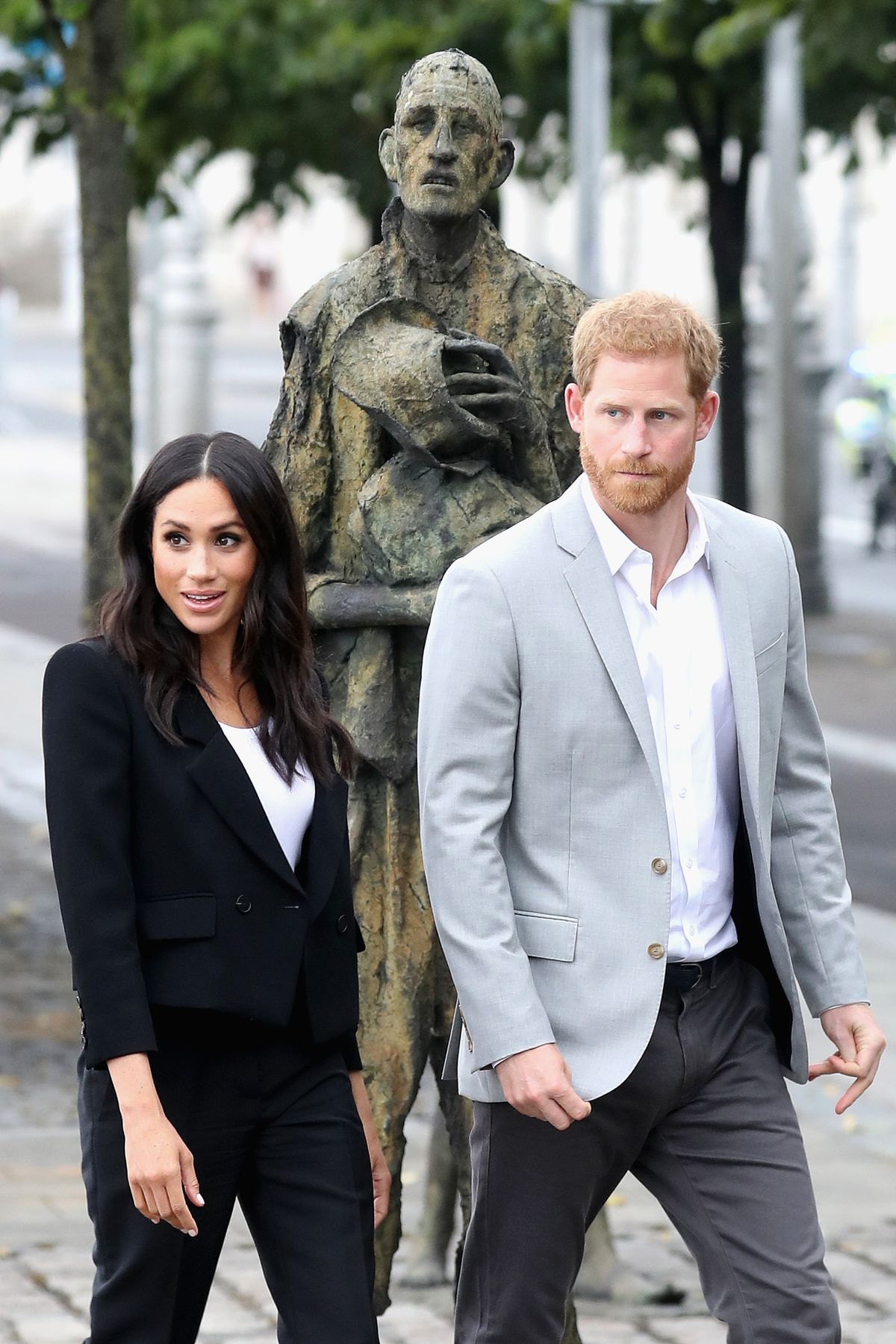 Prince Harry, Duke of Sussex and Meghan, Duchess of Sussex view the Famine Memorial on the bank of the River Liffey during their visit to Ireland on July 11, 2018 in Dublin, Ireland.