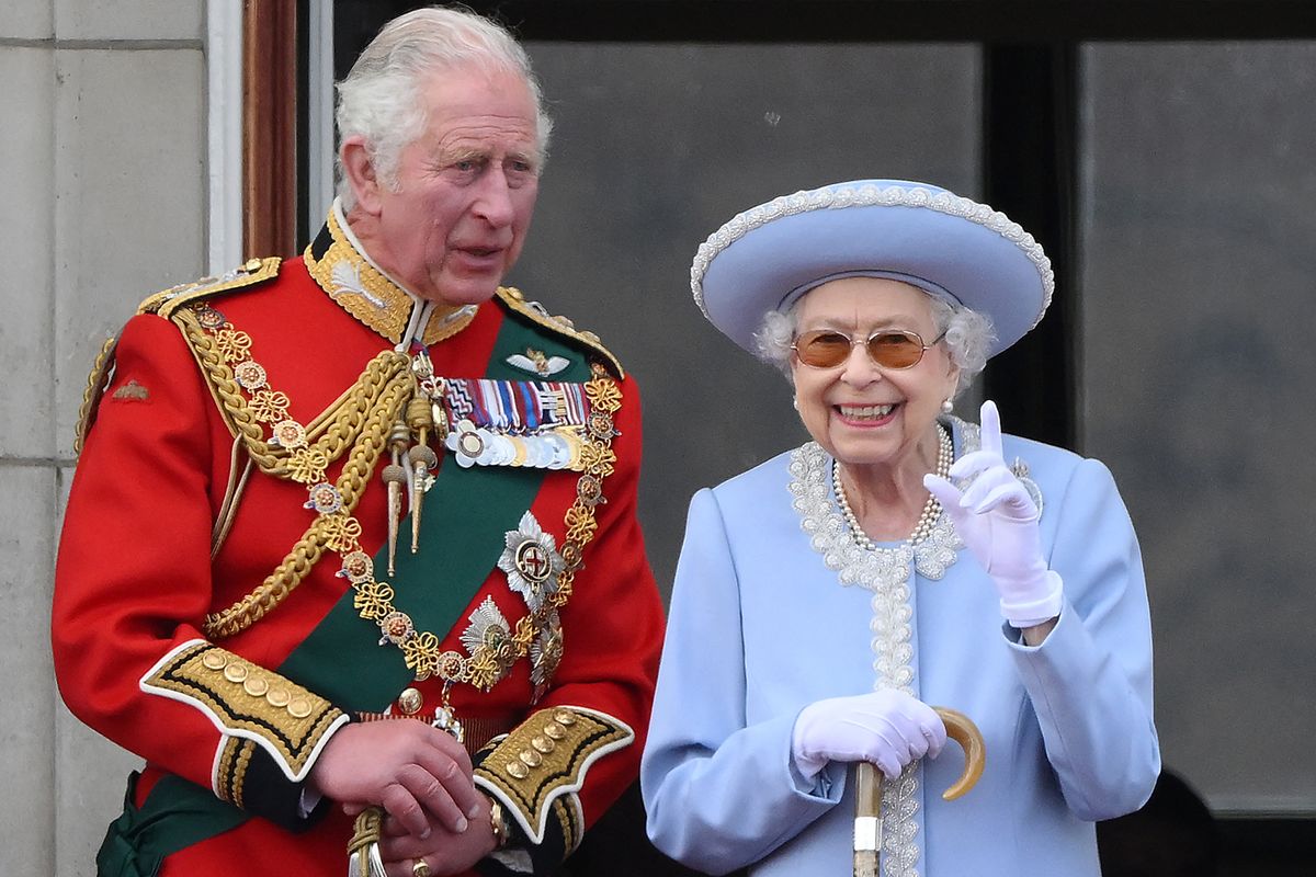 King Charles, then Prince of Wales, standing beside his mother, Queen Elizabeth II, on the Buckingham Palace balcony