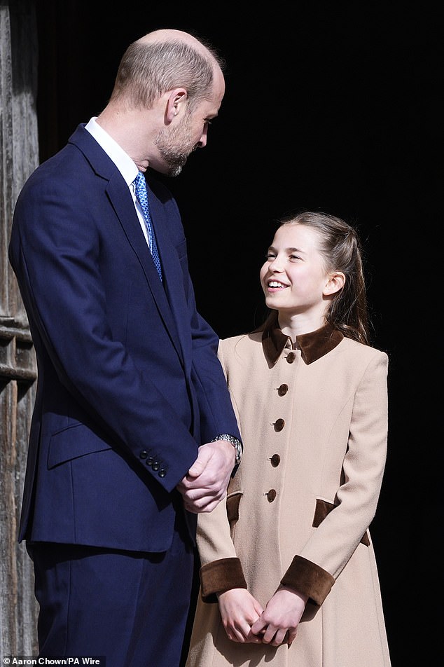 Prince William chats with his smiling daughter, Princess Charlotte, as they attend the Easter Service at Windsor Castle