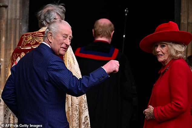 Charles smiles as he arrives with Queen Camilla for the Easter Service