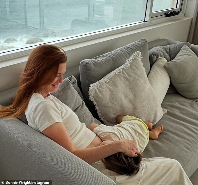 The actress, 35, who played Ginny Weasley in the film franchise, took to Instagram on Sunday to share sweet photos of her two-year-old son Elio kissing her blossoming baby bump