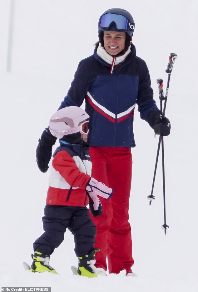 Pippa Middleton, 42, guides her young daughters Grace, five, and Rose, three, through the snow on a family ski break in the French Alps
