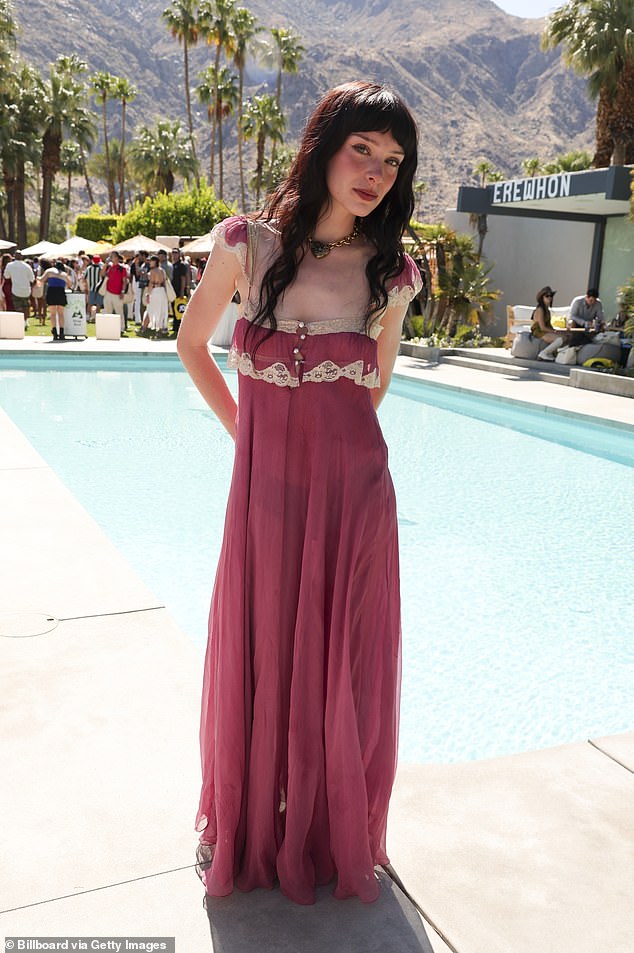 Holly Humberstone meanwhile opted for a full-length Little House on the Prairie chic frock with lace trim and a mesh decolletage