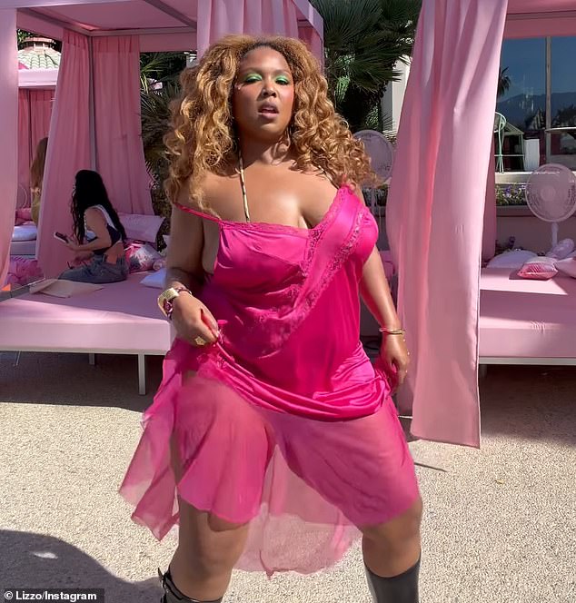 Lizzo flaunted her 60lb weight loss as she showcased her dance moves while grooving towards the camera