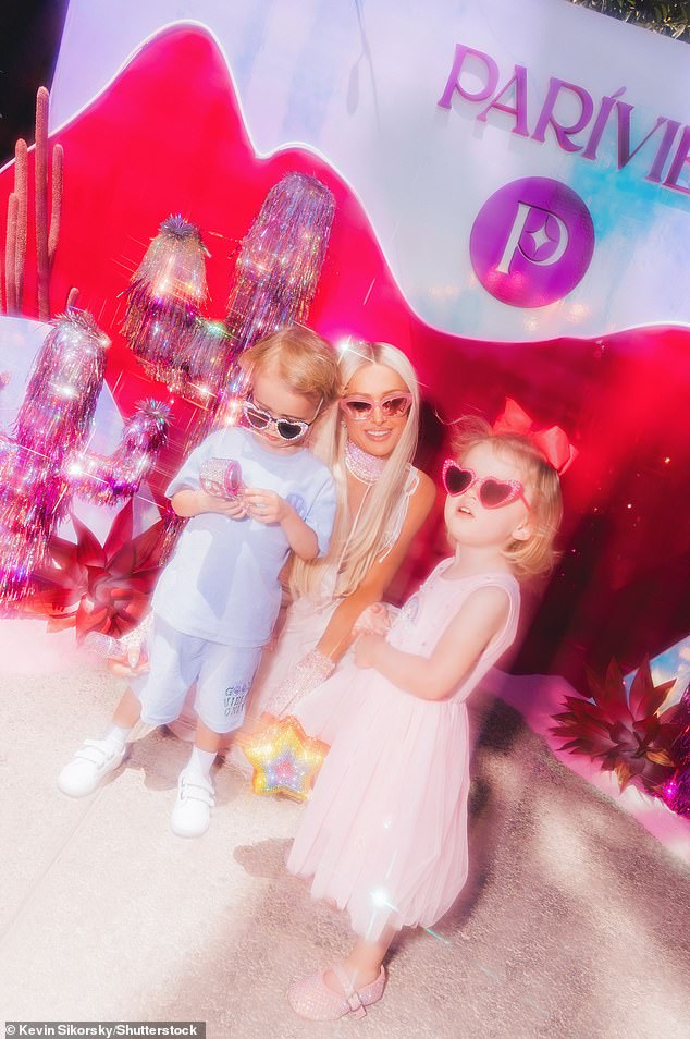 On Saturday, Paris Hilton was also in the desert and threw her own Parivie Oasis event. She brought along her two young children — her son Phoenix, three, and her two-year-old daughter London