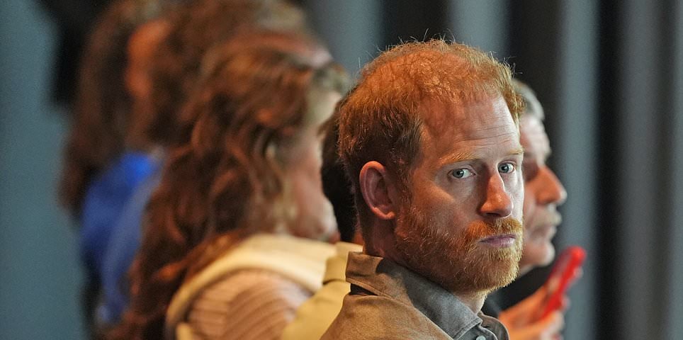Prince Harry opens up about the 'real struggles' of fatherhood as he reveals he went to therapy as a new dad during emotional talk at AFL club - while Meghan is nowhere to be seen