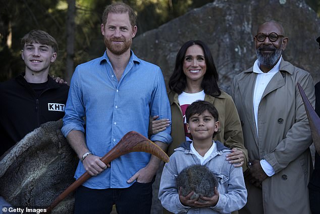 Prince Harry, Duke of Sussex and Meghan, Duchess of Sussex pose for a photo during a Scar Tree Walk as the honoured Aboriginal culture