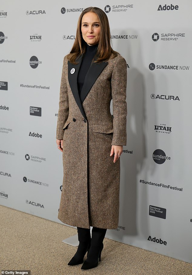 Portman seemed to be displaying a hint of a baby bump in her double-breasted coat