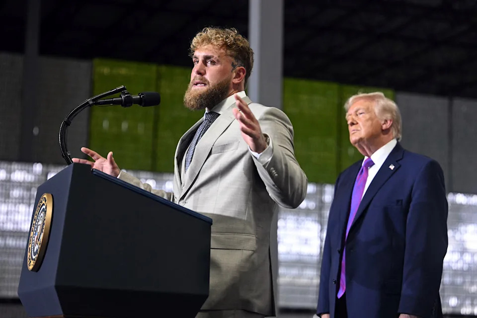 Jake Paul & Trump standing at a podium