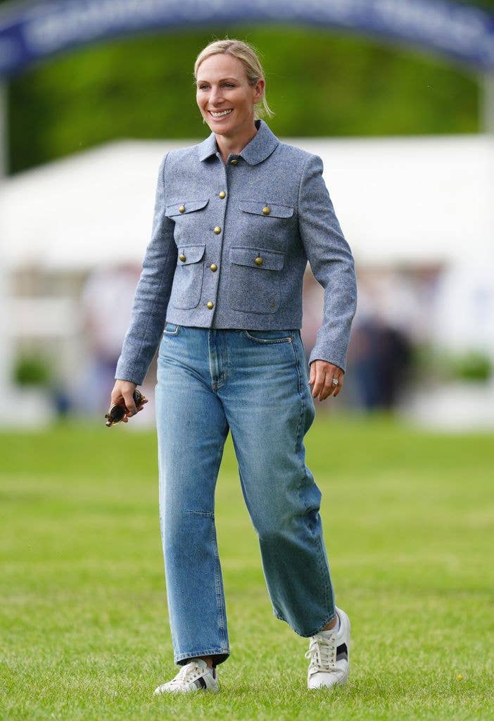 Zara Tindall in a blue jacket and jeans