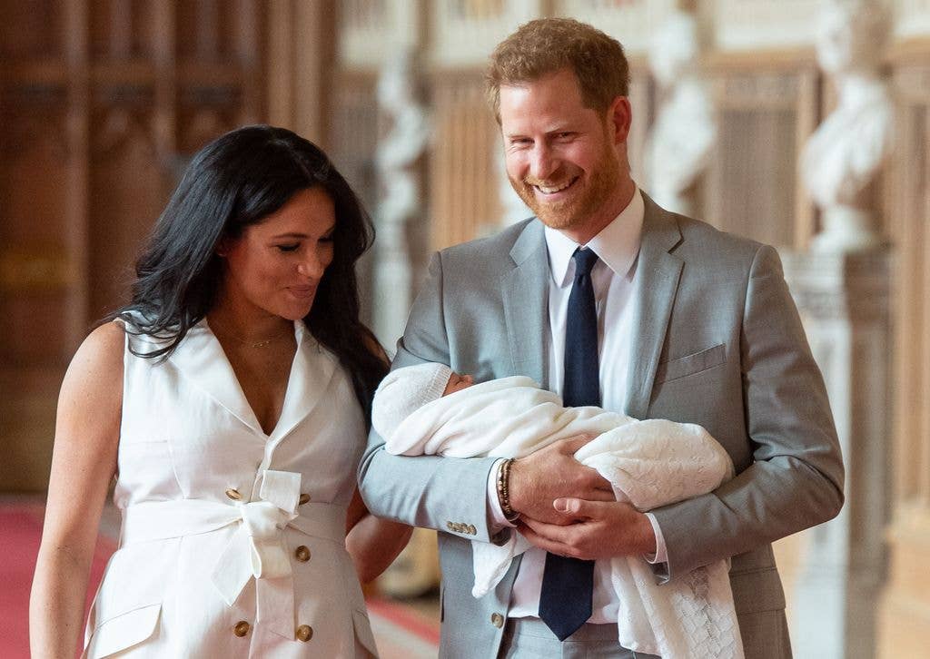 Meghan smiling at Harry holding baby Archie in Windsor