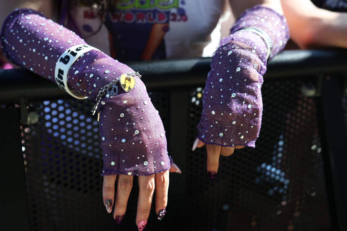 Justin Bieber fans including Rosa Espinoza, 27, from Goodyear, Arizona, camp out at the Coachella stage.