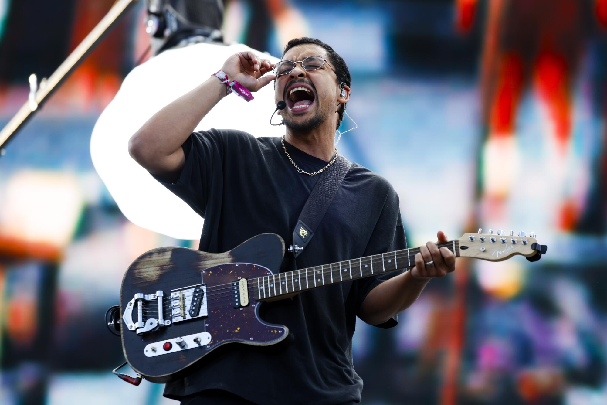 Dijon plays guitar and performs on the Outdoor Theatre.