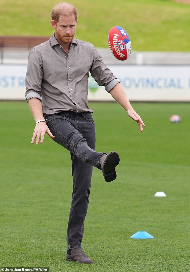 The Duke of Sussex kicks a sherrin ball during a  Western Bulldogs Australian rules football session, during a visit to Movember at the Western Bulldogs HQ at Mission Whitten Oval, in Footscray, Melbourne, on day two of the royal trip to Australia. Picture date: Wednesday April 15, 2026. PA Photo. Photo credit should read: Jonathan Brady/PA Wire