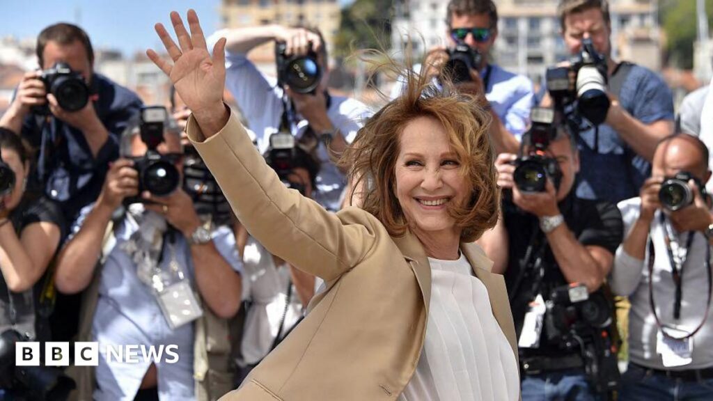 Politics Essential logo showing Houses of Parliament against a red background