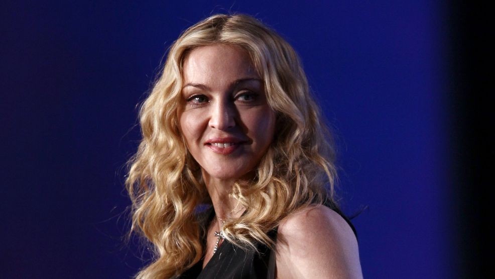 INDIANAPOLIS, IN - FEBRUARY 02:  Singer Madonna looks on on during a press conference for the Bridgestone Super Bowl XLVI halftime show at the Super Bowl XLVI Media Center in the J.W. Marriott Indianapolis on February 2, 2012 in Indianapolis, Indiana.  (Photo by Win McNamee/Getty Images)
