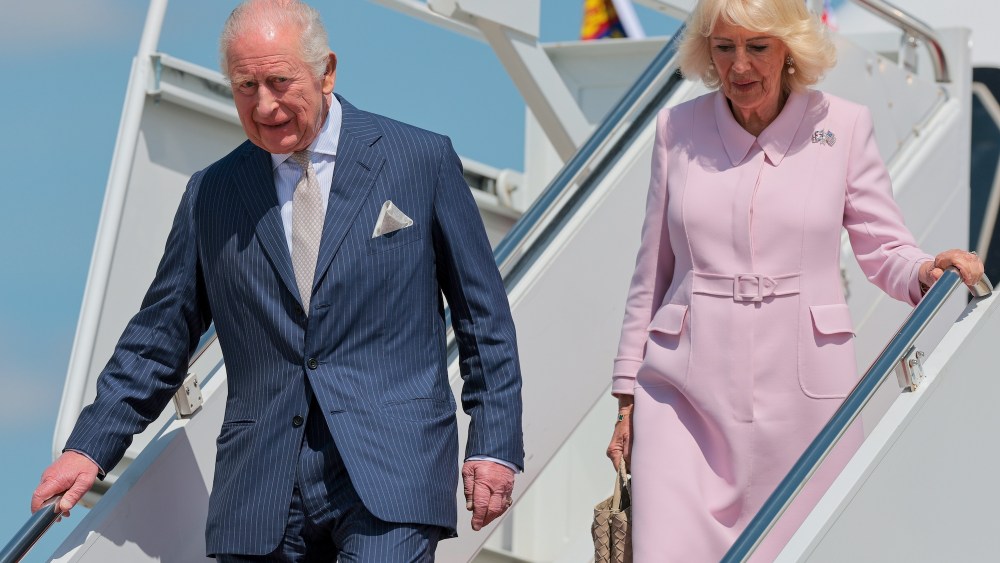 King Charles III and Queen Camilla, who wears the Cartier Union Jack and Stars and Stripes Brooch, disembark their plane as they arrive on day one of their State Visit to the United States, on April 27, 2026 at Joint Base Andrews, Maryland.