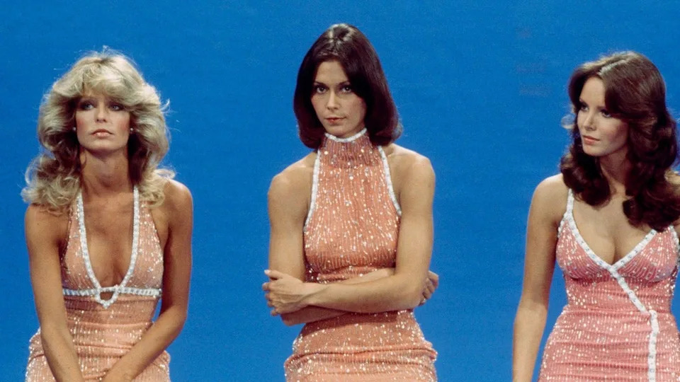 Kate Jackson standing with Farrah Fawcett and Jaclyn Smith wearing glitter dresses