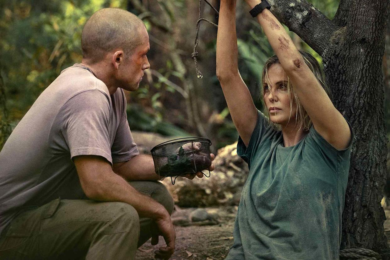 Taron Egerton and Charlize Theron in ApexCredit: Kane Skennar/Netflix