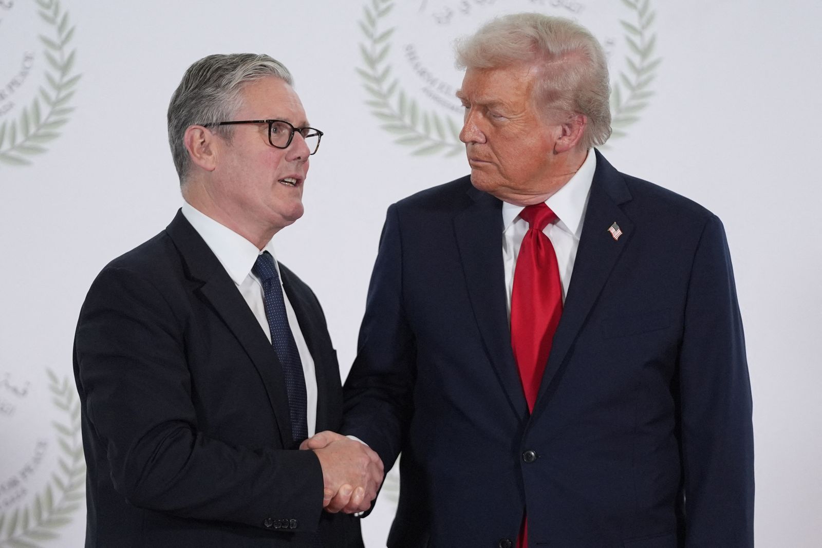 Image may contain Keir Starmer Donald Trump People Person Accessories Formal Wear Tie Body Part and Hand