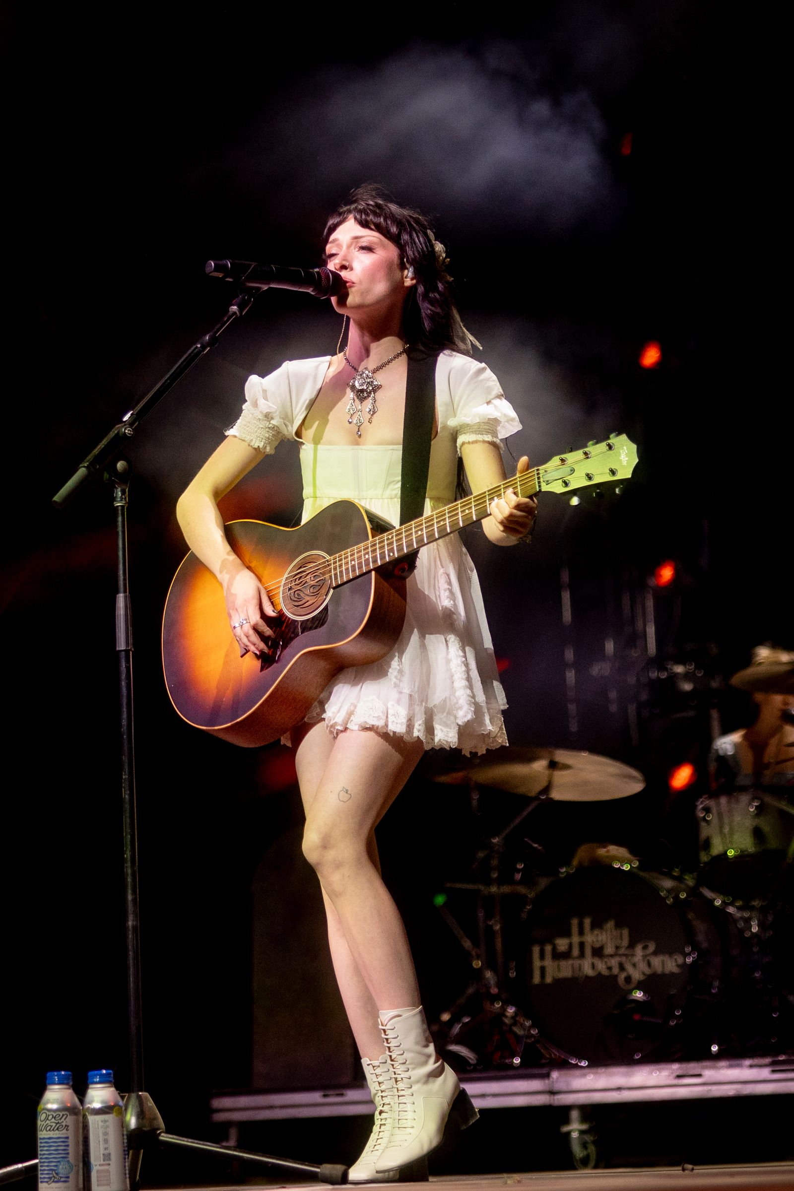 Image may contain Guitar Musical Instrument Performer Person Solo Performance Teen Electrical Device and Microphone