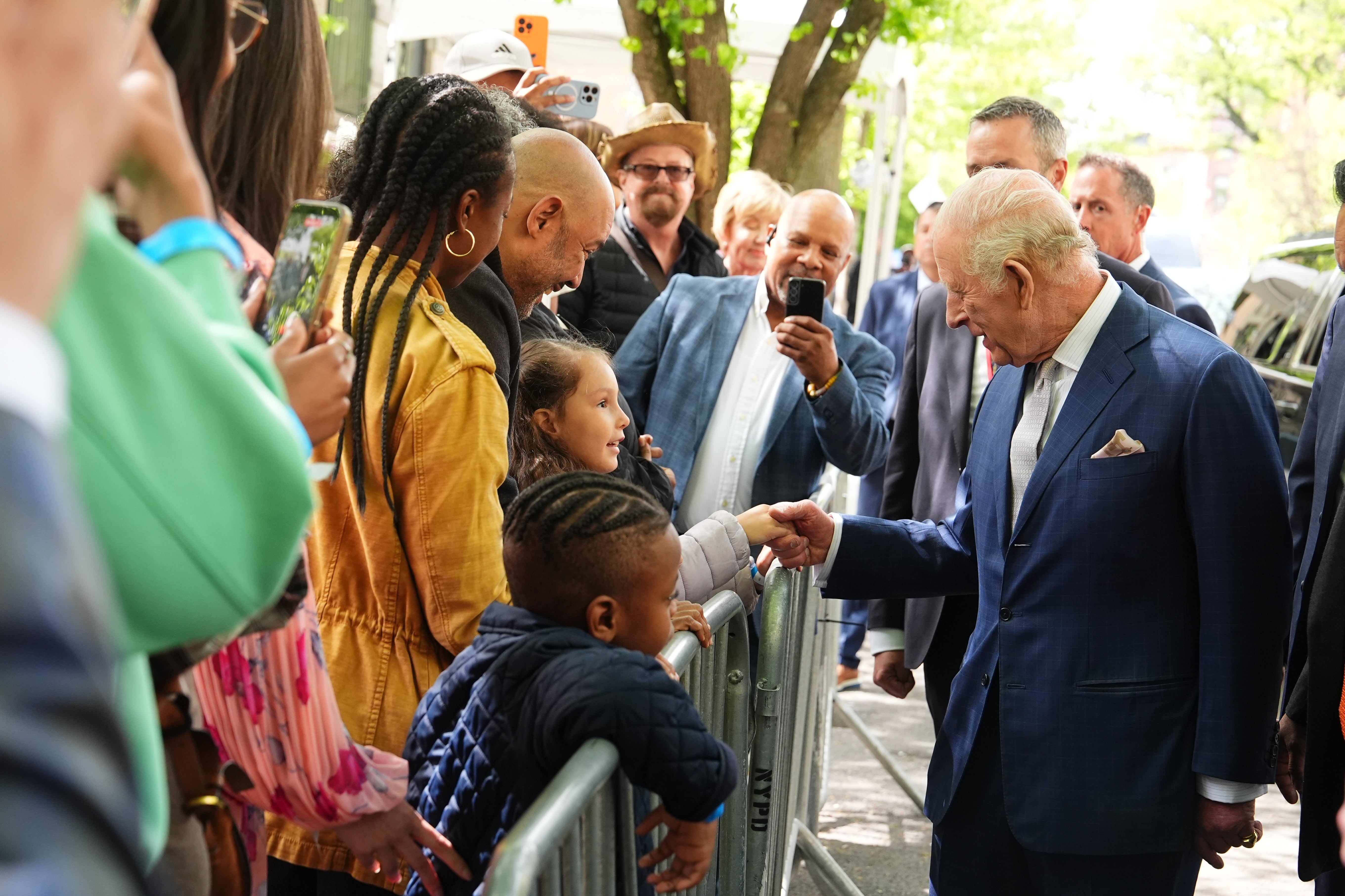 King Charles meets members of the public during a visit to Harlem Grown, a local community organisation and after-school initiative tackling systemic health, education and wellbeing challenges faced by children and families in Upper Manhattan on day three of a state visit by King Charles III and Queen Camilla