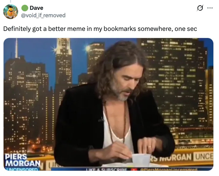 Person with long hair in a studio setting, opening a container, with a cityscape backdrop. Text mentions a meme and bookmarks