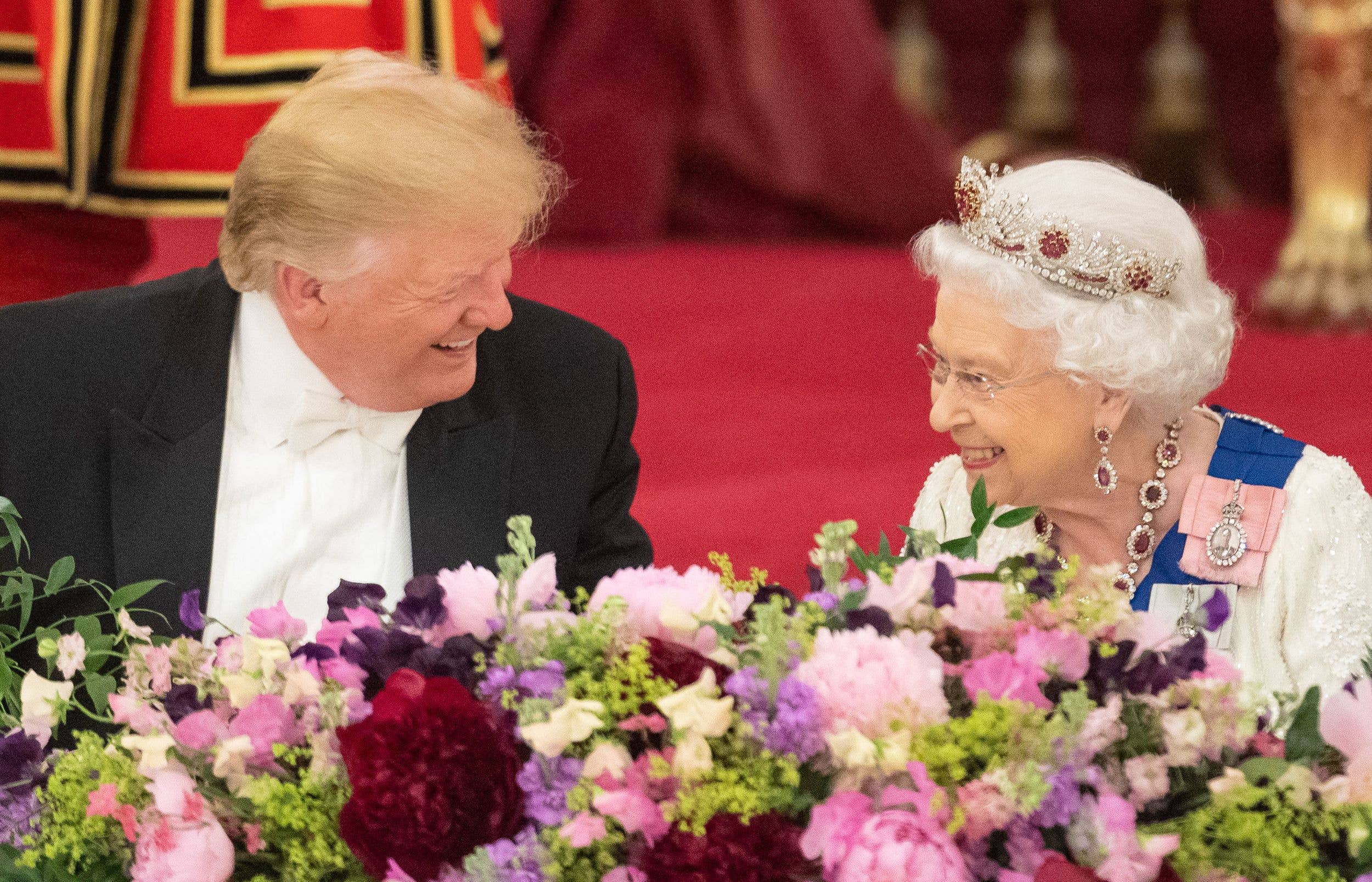 The president pictured with Queen Elizabeth at the 2019 state banquet